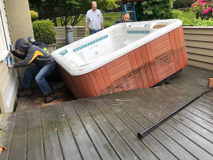 taking out a massive hot tub