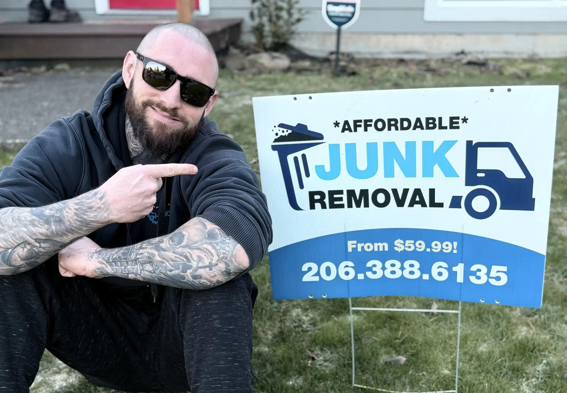 founder of northwest labor industries pointing at their posted for junk removal